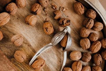 Walnuts and metal nutcracker. Healthy food and snacks.Healthy fats. Keto diet ingredient. Nuts and seeds. Useful healthy snack.