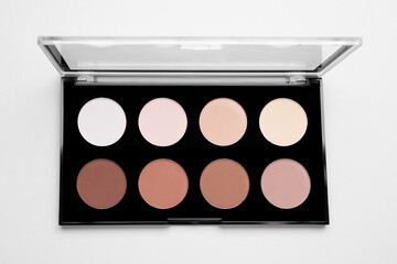 Colorful contouring palette on light grey background, top view. Professional cosmetic product