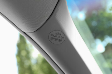 Safety airbag sign on pillar panel inside car