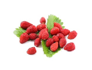 Ripe wild strawberries and green leaves isolated on white