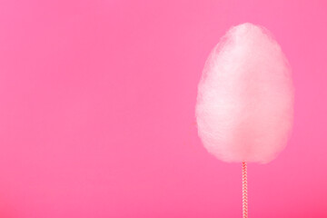 One sweet cotton candy on pink background, space for text