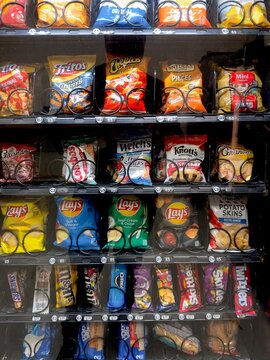 Assortment of snack options in a public vending machine with ready to eat food. Cleveland, Ohio, USA
