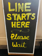 Line starts here please wait sign 