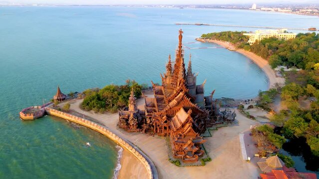 Wooden temple by the ocean Sanctuary of Truth, Pattaya, Thailand, Sanctuary of Truth pagoda during sunset, Buddhist temple by the ocean at sunset