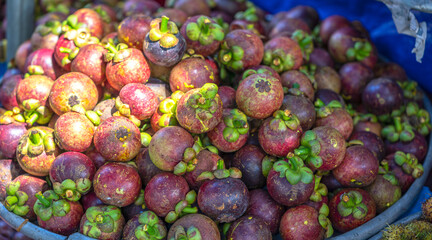 Mangosteen fruit for sale at the market, Vietnam fruits, specialties from Lai Thieu region, Binh...