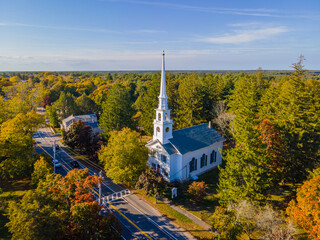 First Unitarian Church with fall foliage aerial view at 223 Main Street, in historic town center of Kingston, Massachusetts MA, USA.