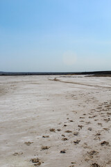 Close up on dried land covered in salt at lake Baskunchak in Russia