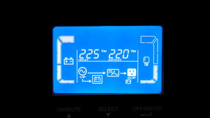 Close up of digital display on uninterruptible power supply with automatic voltage stabilizer.