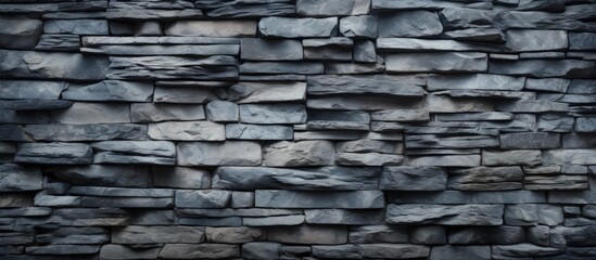 Stone wall texture with a grey background.