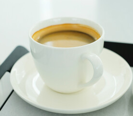 A cup of hot coffee on white background