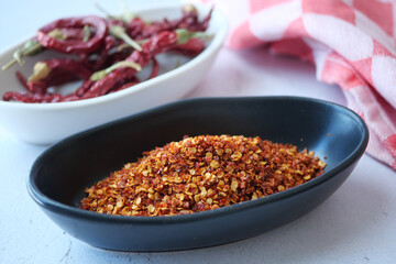 chili flakes in a bowl on table 