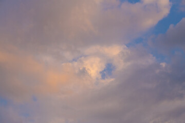 Colorful sunset or sunrise in the sky. The clouds are brightly colored. Beautiful background.