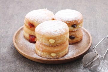 donuts of various shapes with colorful toppings with a variety of sweet and savory flavors