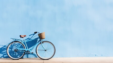Bicycle on blue wall with copy space for your text or design
