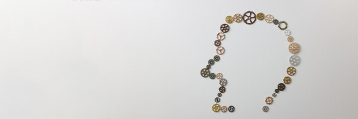 Many different gears shaped as human head on white background.