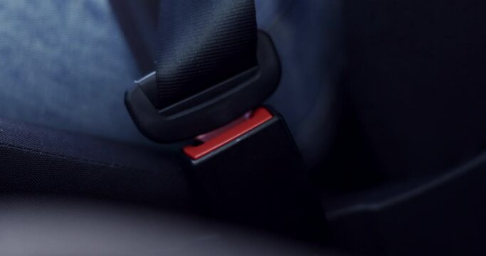 Seat belt, hand and car closeup for driver protection, safety and road law for travel and motor transport. Drive, person and journey with seatbelt fastening and security of auto accident and danger