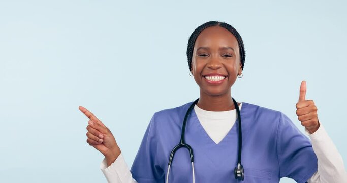 Happy black woman, doctor and pointing with thumbs up in success against a studio background. Portrait of African female person, medical or healthcare nurse show list with like emoji or yes in mockup