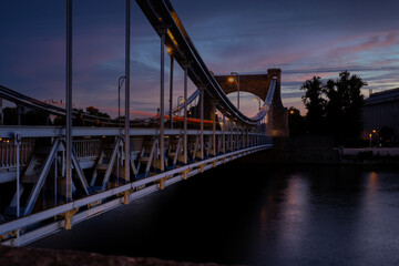 Panoramic evening view on Wroclaw Old Town. Silhouette of Island and Cathedral of St John with bridge through river Odra. Wroclaw, Poland. Grunwaldzki bridge over the Odra river