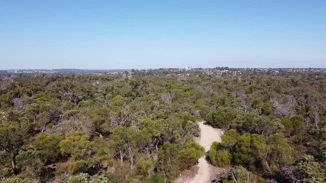 Biking trail between trees between Clarkson and Joondalup, Perth - Western Australia