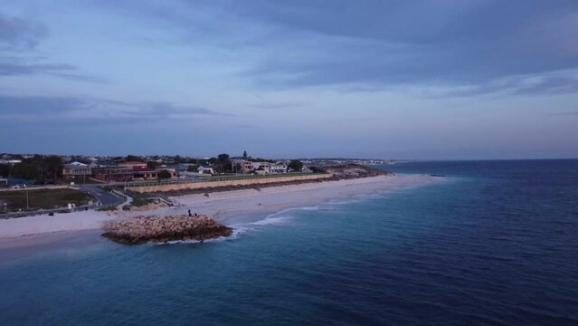 Sun fades over the Indian Ocean coastline at Quinns Rock Beach, Australia. Aerial