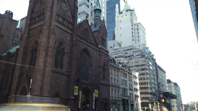 Manhattan, NY, USA - Feb. 22. 2020: Hyper-Lapse of Fifth Avenue Presbyterian Church and Manhattan Skyline