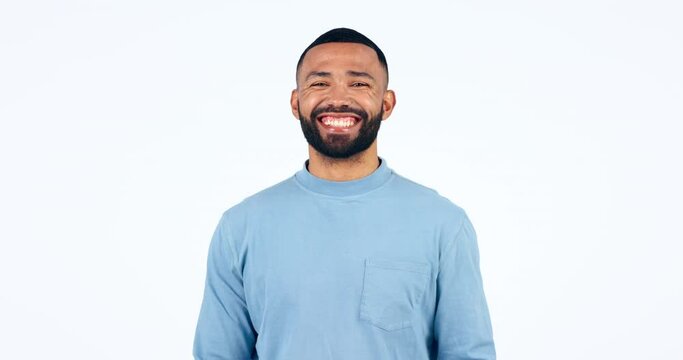 Face, Funny Man And Wink In Studio Isolated On A White Background Mockup Space. Portrait, Flirting And Laughing Person Blink Eye, Happy Smile And Confident In Clothes For Trendy Fashion Style