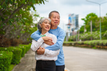 Elderly love, couple relaxing outdoors in blissful family time, peaceful moments, Mature asian husband and wife family time in natural serenity, heartwarming, relaxation