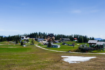 lot of houses on a mountain for hiking and skiing with sky