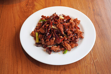 Mala chicken is a Crispy, tasty chicken pieces stir-fried with a generous amount of dried chillies and Sichuan pepper