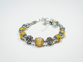 Silver and natural gemstone jewelry on white background