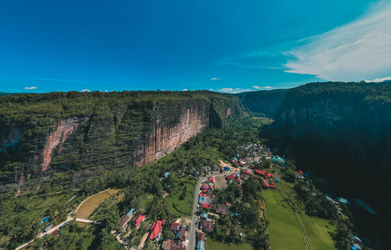 Aerial view Harau Valey or Lembah Harau with Rumah Gadang in the middle of rice field, west sumatra, indonesia