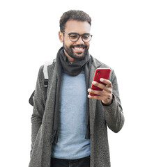 Young handsome man with backpack holding smart phone isolated transparent PNG, Smiling student men looking at mobile phone isolated portrait - 645222537