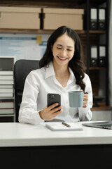 businesswoman sitting in office chair relaxing, female feeling peaceful resting at workplace.