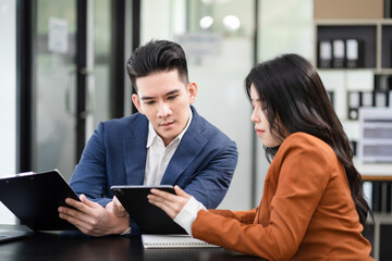Professional investor working new start up project. Finance managers meeting.using laptop and digital tablet computer in office.