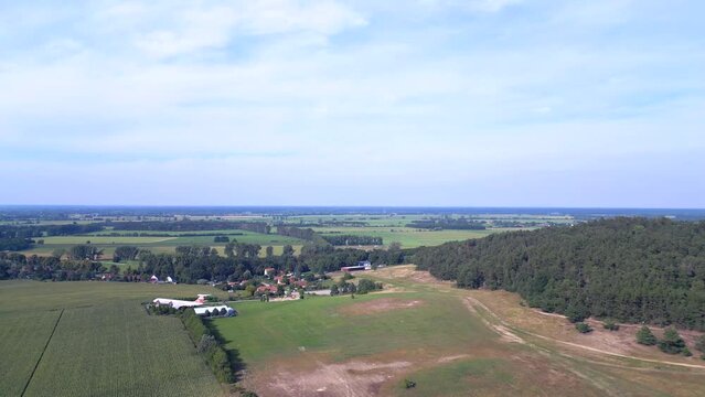 Wonderful aerial top view flight 
Iljuschin aircraft on ground. hilly summer fields Brandenburg Germany summer 23. speed ramp Hyperlapse motionlapse timelapse
High quality 4k cinematic footage
