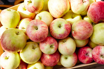 Bunch of organic fresh apples on a market. Overhead view of fresh organic apples. Healthy eating concept