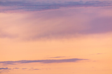 Pink blue clouds at sunset as background
