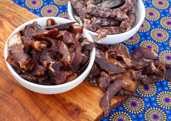 South African Traditional Biltong and dry wors on blue traditional printed cloth. 