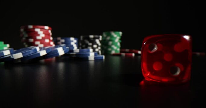 Table are game chips and dice. Game chips for betting in gambling