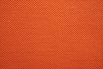 Full frame shot of orange polyester fabric texture and background.