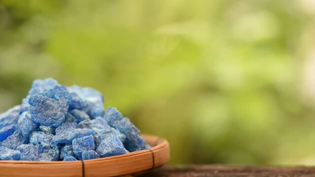 Copper sulphate crystals on natural background.