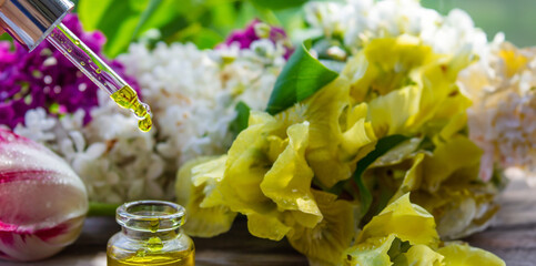 Essential oil extract of herbs and flowers. Selective focus