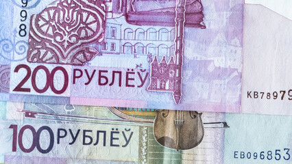 Belarusian paper money of different denominations 50, 100, 200 BYN on white background. Banknotes of the Republic of Belarus. Colored currency. Belarusian rubles
