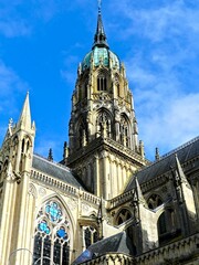 Fototapeta premium Bayeux, August 2023 - Visit the magnificent medieval town of Bayeux in Normandy - View of the magnificent Notre-Dame de Bayeux cathedral