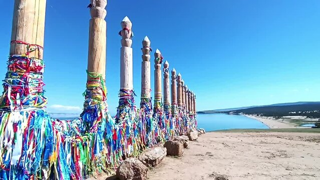 Serge pillars with bright ribbons on the island of Olkhon