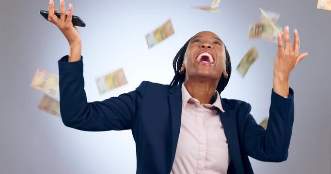Happy black woman, phone and money rain in celebration, winning or good news against a studio background. Excited African female person with smartphone, cash and business success in financial freedom