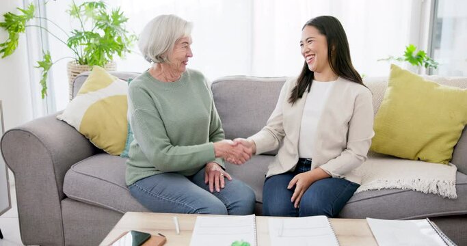 Financial advisor, senior woman and handshake for asset management, agreement and signature or contract documents. Broker or notary shaking hands with elderly client on home sofa for pension success