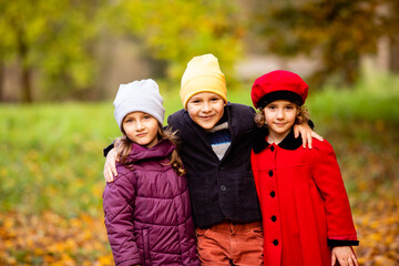 Group of friends play in autumn park