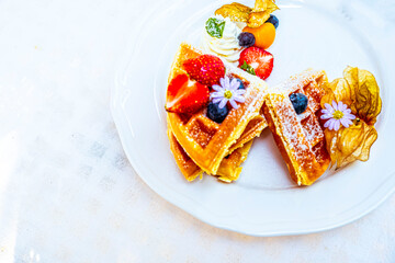 Healthy Brunch Delights: Whole Grain Waffles adorned with Fresh Fruits