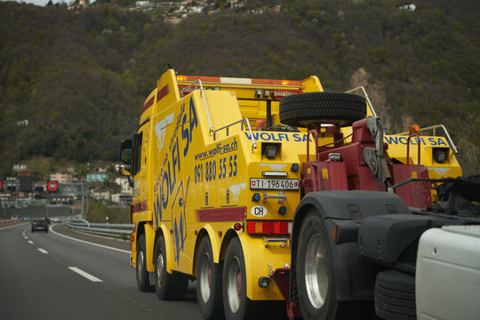 13.04.2023 Switzerland, Europe. Truck towing truck. Truck carrying semi-truck on the highway
